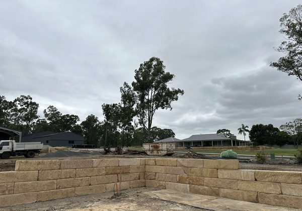 Sandstone wall under construction showing drainage
