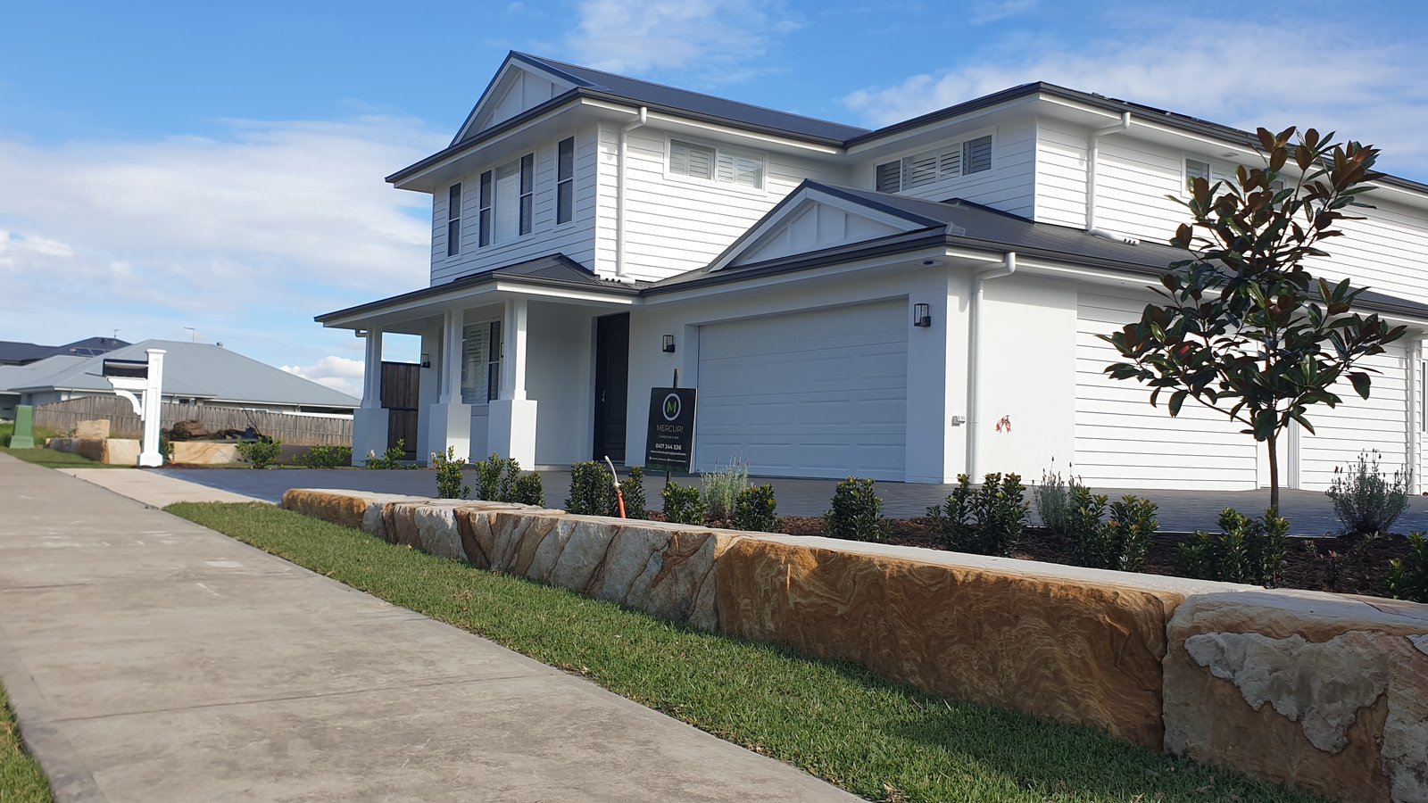 Completed sandstone retaining wall, Sydney